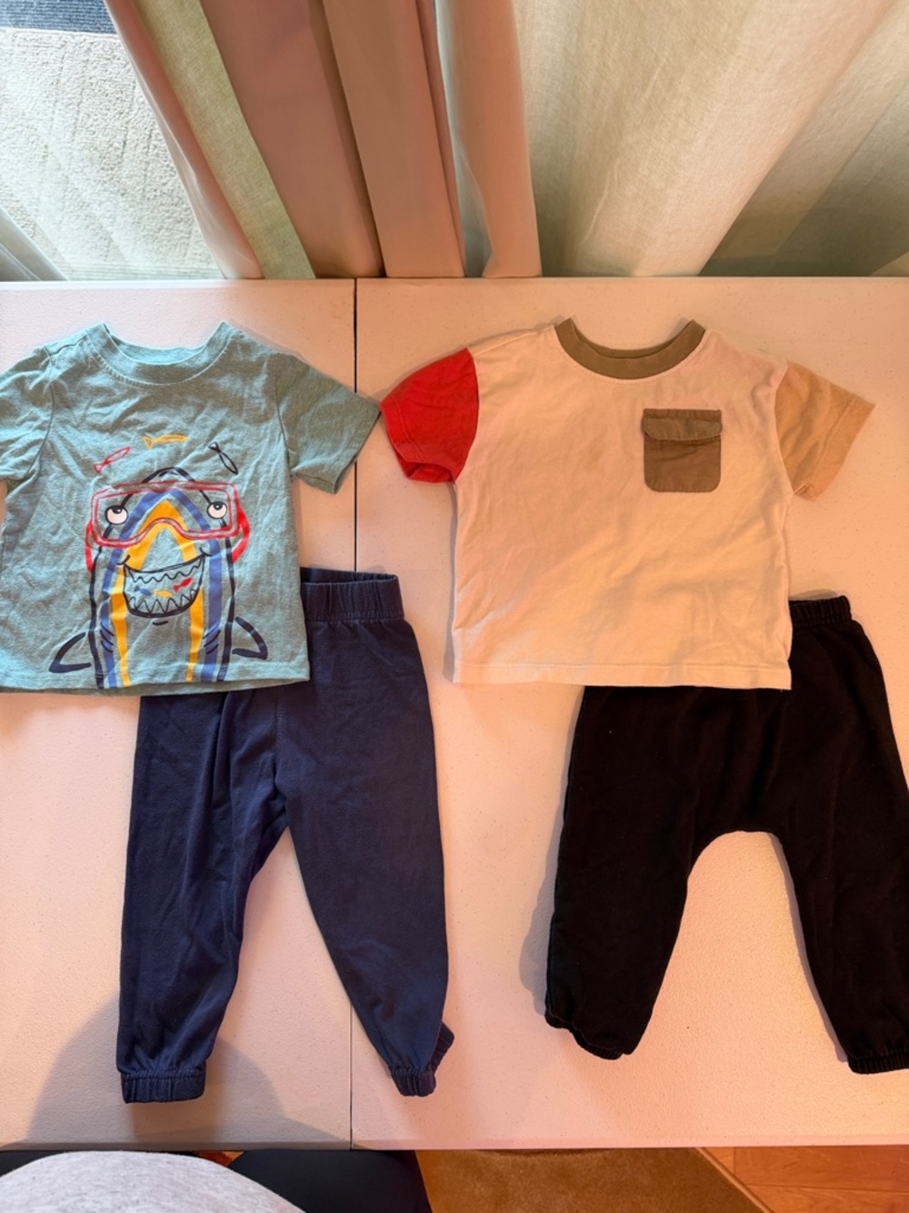 (2) sets of shirt sleeve tees and sweatpants. Size 18 months
